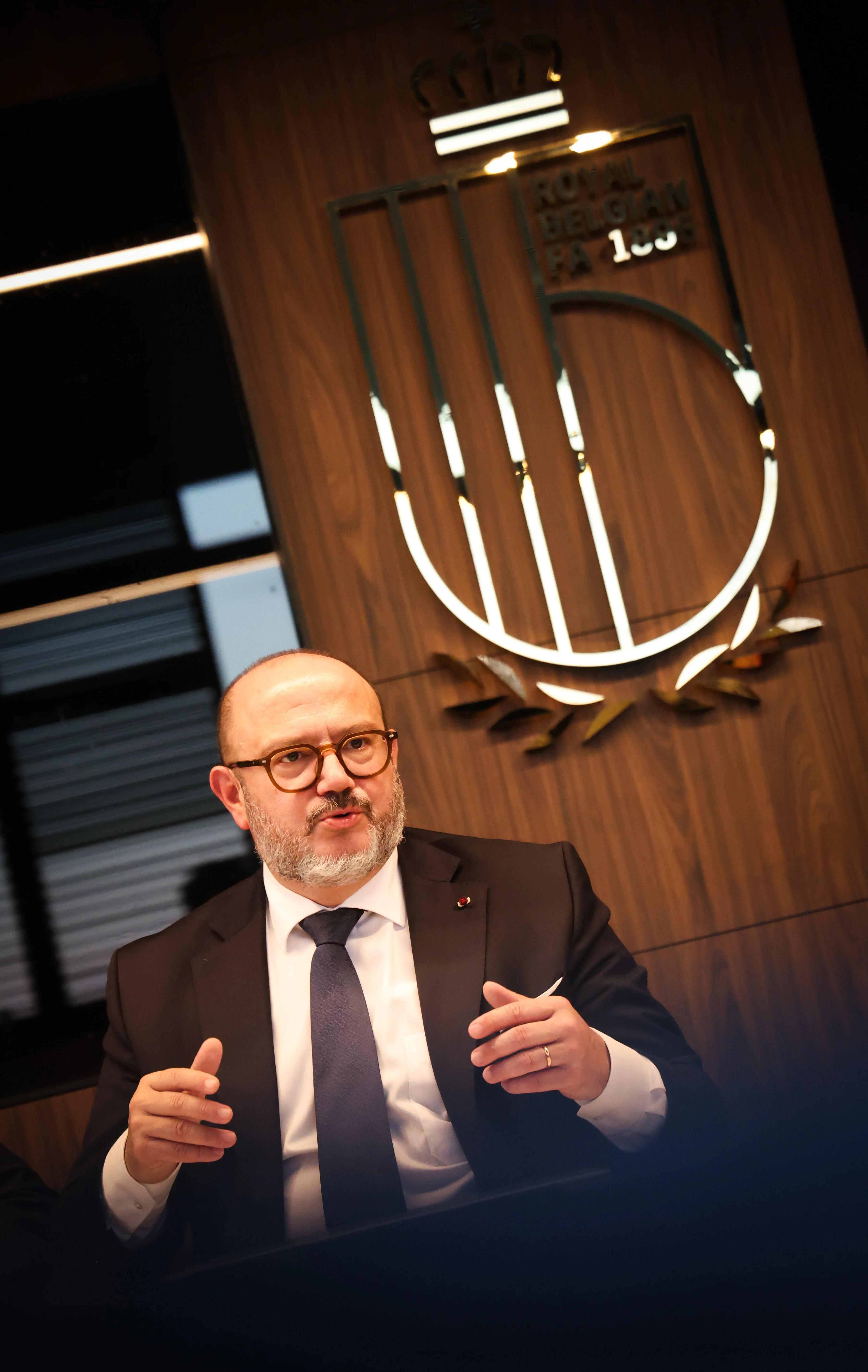 Minister of Interior Bernard Quintin gestures during a press conference after a round table on safety in football, organised by the Pro League and the Royal Belgian Football Association (RBFA), Friday 07 November 2025 in Tubize. BELGA PHOTO VIRGINIE LEFOUR