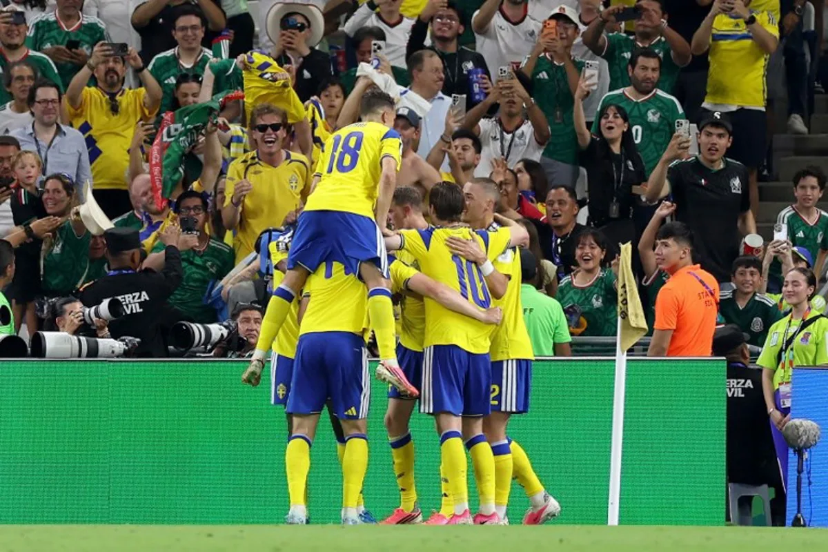 Sweden's forward #17 Viktor Gyokeres (unseen) celebrates with teammates scoring his team's third goal during the 2026 World Cup Group F football match between Sweden and Tunisia at the Monterrey Stadium in Guadalupe on June 14, 2026. Julio Cesar AGUILAR / AFP