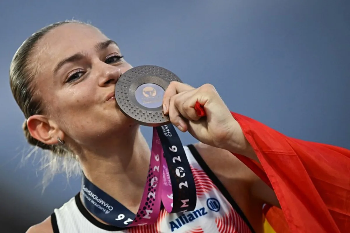 Bronze medallist Belgium's Jana van Lent celebrates after competing in the women's 10,000m final during the European Athletics Championships at Alexander Stadium in Birmingham on August 14, 2026.  Paul ELLIS / AFP
