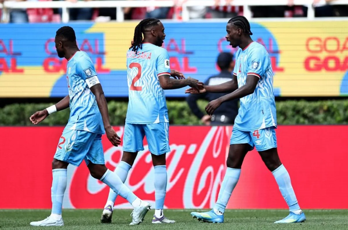 DR Congo's defender #04 Axel Tuanzebe (R) celebrates with teammate defender #02 Aaron Wan-Bissaka after scoring a goal in extra time during the 2026 FIFA World Cup qualifiers final playoff football match between the Democratic Republic of the Congo and Jamaica at the Akron Stadium in Zapopan, Jalisco state, Mexico, on March 31, 2026. Ulises Ruiz / AFP