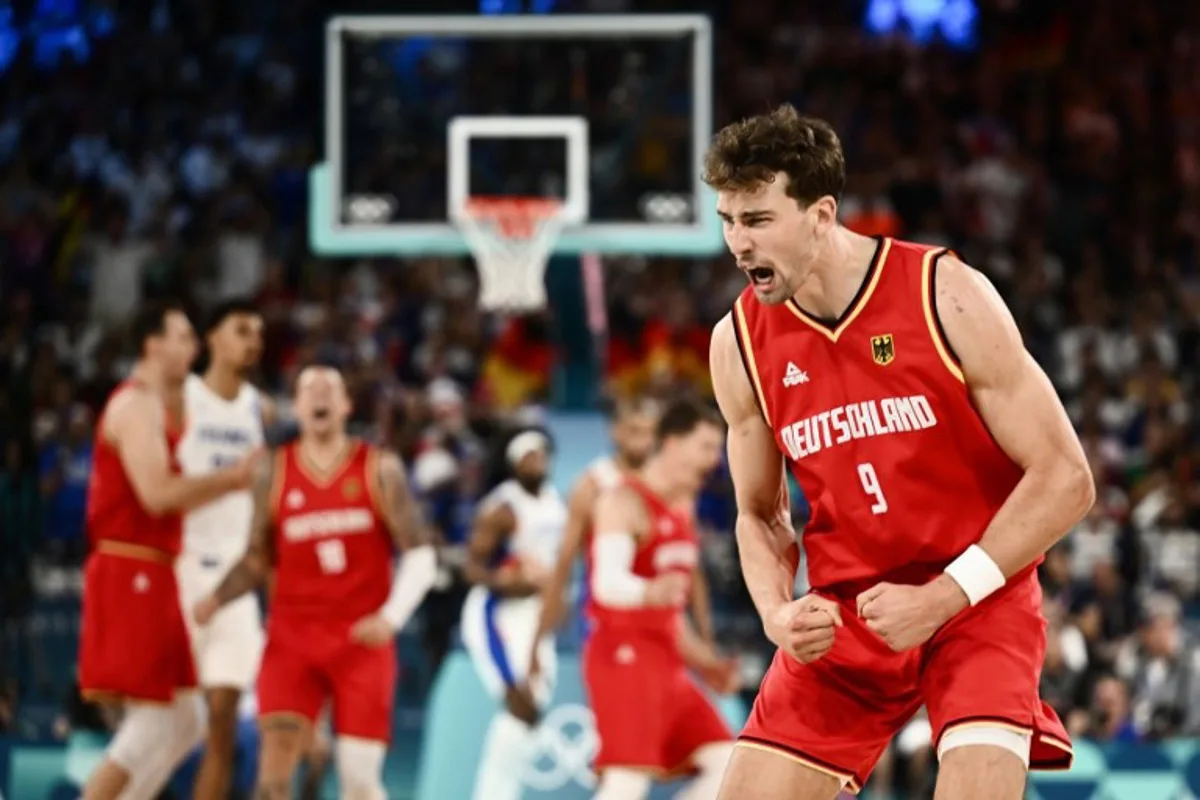 Germany's #09 Franz Wagner celebrates after scoring in the men's semifinal basketball match between France and Germany during the Paris 2024 Olympic Games at the Bercy  Arena in Paris on August 8, 2024.  Aris MESSINIS / AFP