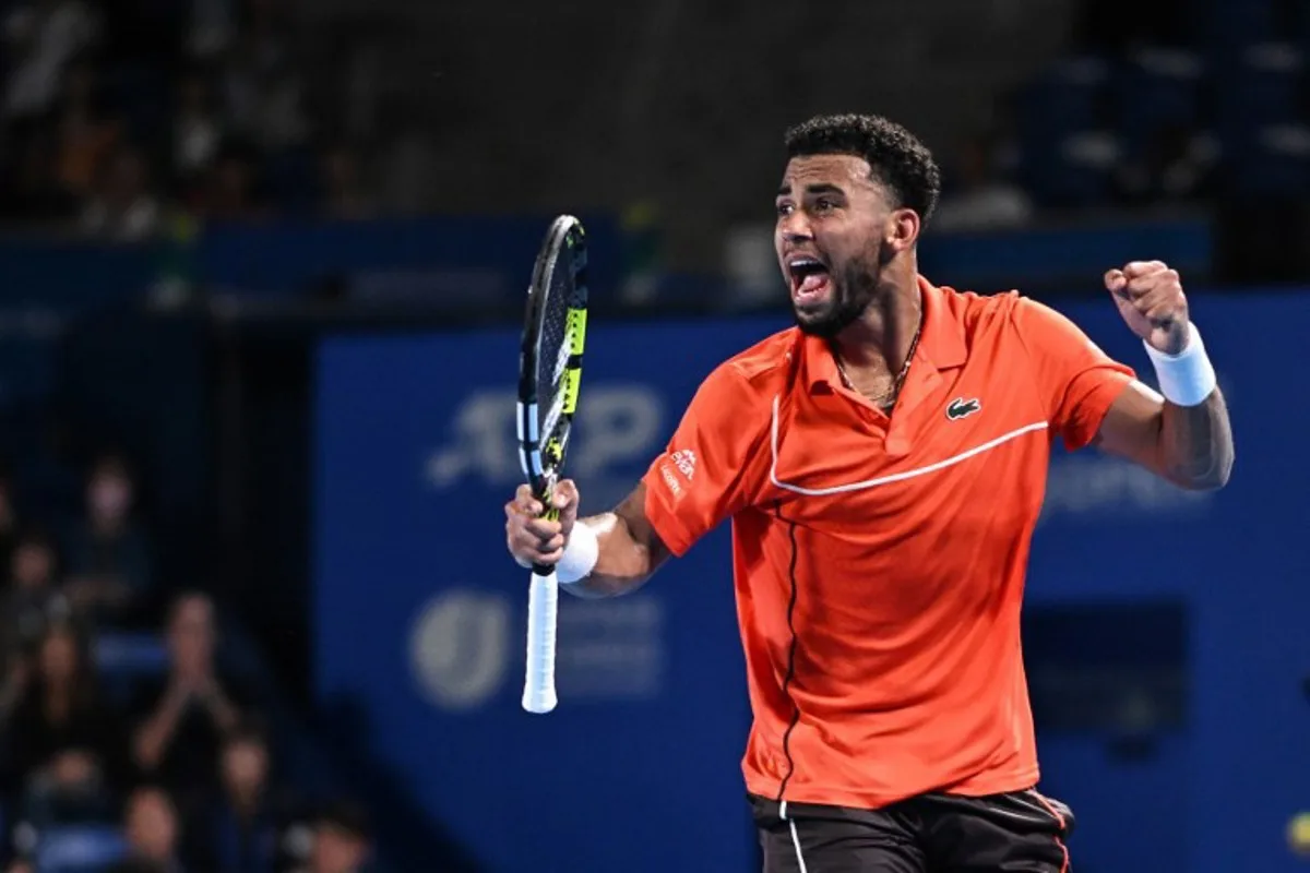 France's Arthur Fils reacts after a point against France's Ugo Humbert during the men's singles final match on the seventh day of the ATP Japan Open tennis tournament in Tokyo on October 1, 2024.  Philip FONG / AFP