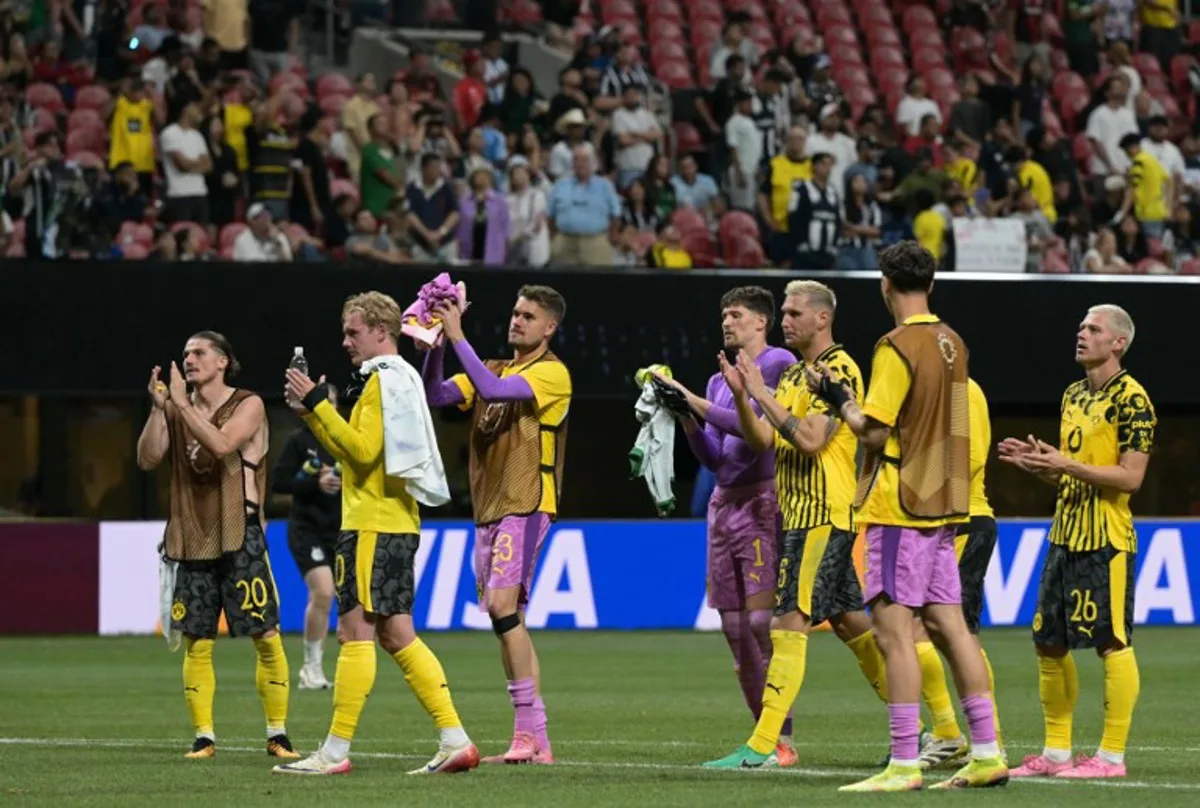 Borussia Dortmund players acknowledge the crowd after winning the FIFA Club World Cup 2025 round of 16 football match between Germany's Borussia Dortmund and Mexico's Monterrey at the Mercedes-Benz Stadium in Atlanta on July 1, 2025. JUAN MABROMATA / AFP