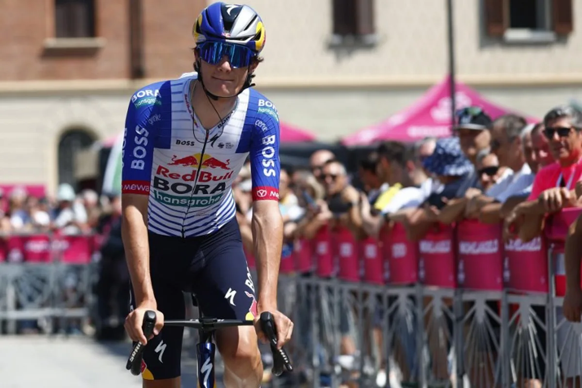 Red Bull - BORA - hansgrohe Italian rider Giulio Pellizzari arrives at the presentation prior the 17th stage of the Giro d'Italia 2026 - Tour of Italy cycling race between Cassano d'Adda and Andalo, Italy, on May 27, 2026. Luca Bettini / AFP