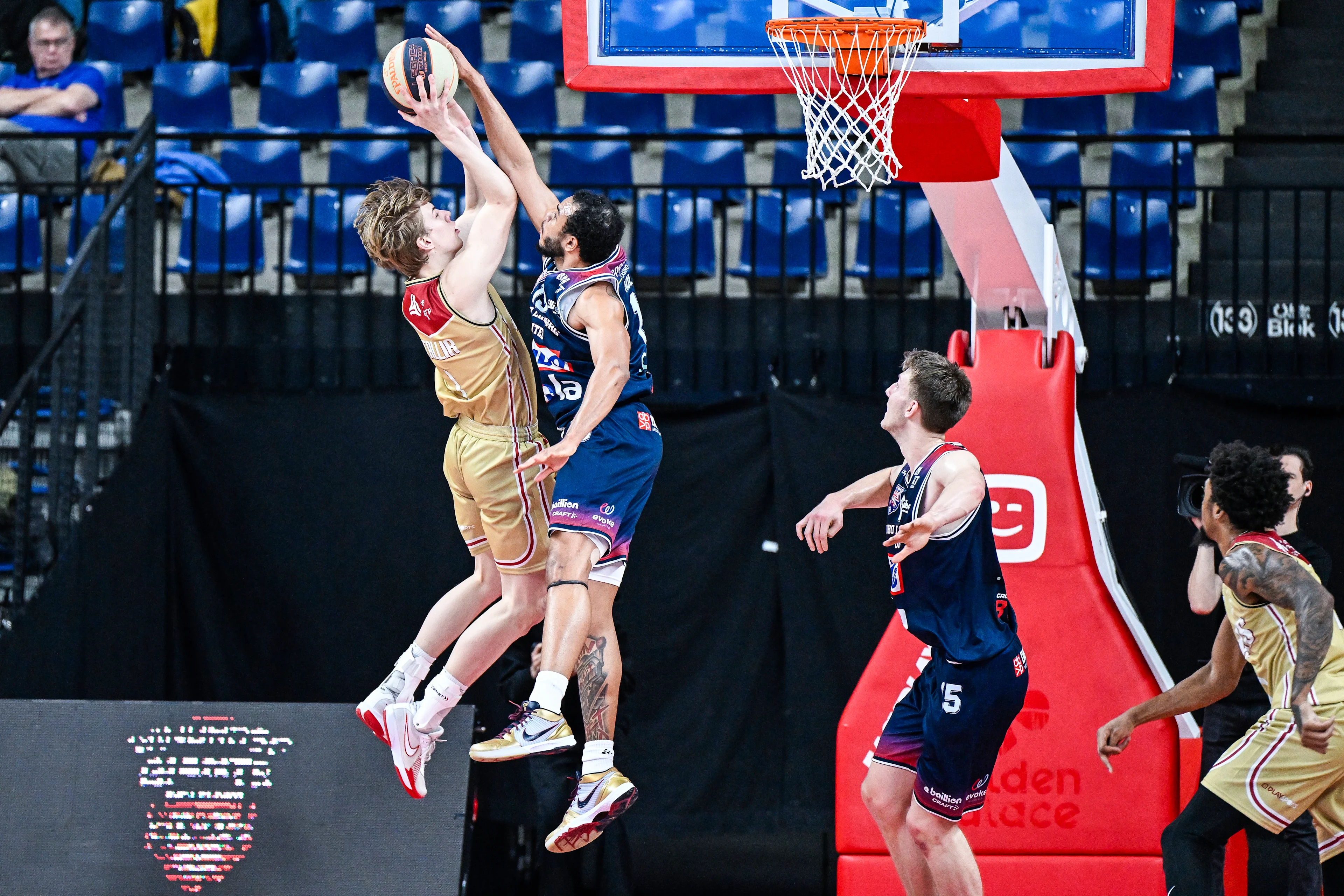 Antwerp's Feie Tallir and Limburg's Jaren Holmes pictured in action during a basketball match between Antwerp Giants and Limburg United, Sunday 05 January 2025 in Brussels, the second leg of the quarter finals of the men's Belgian Basketball Cup. BELGA PHOTO TOM GOYVAERTS