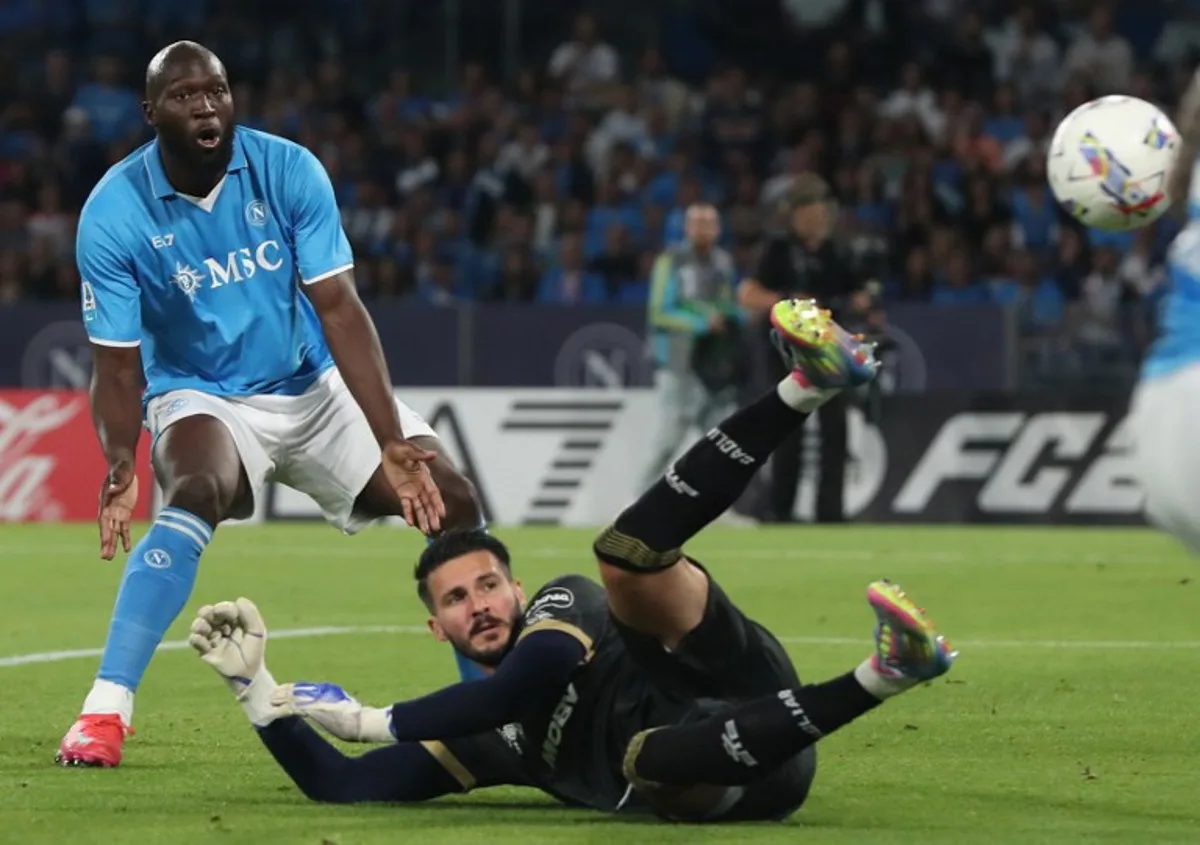 Napoli's Belgian forward #11 Romelu Lukaku reacts after missing an opportunity to score in  front of Cagliari's Albanian goalkeeper #71 Alen Sherri during the Italian Serie A football match between Napoli and Cagliari at the Diego Armando Maradona stadium in Naples on May 23, 2025.  Carlo Hermann / AFP