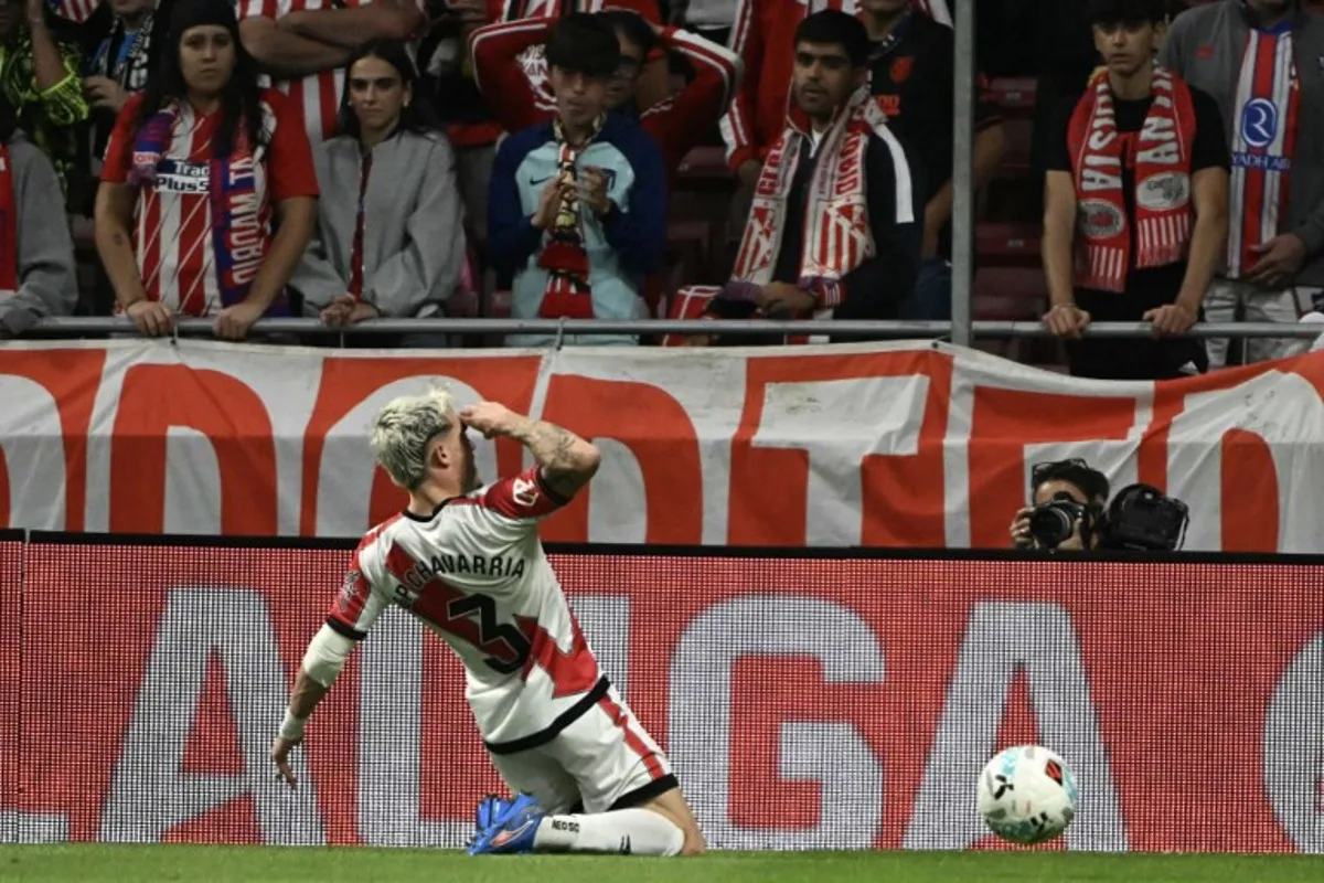 Rayo Vallecano's Spanish defender #03 Pep Chavarria celebrates scoring their first goal during the Spanish league football match between Club Atletico de Madrid and Rayo Vallecano de Madrid at the Metropolitano stadium in Madrid on September 24, 2025. Javier SORIANO / AFP