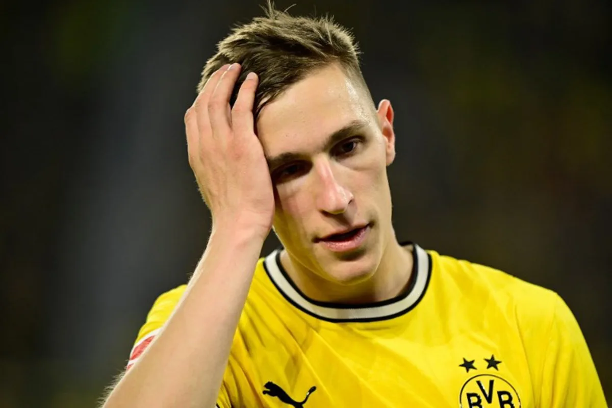 Dortmund's German defender #04 Nico Schlotterbeck reacts during the German first division Bundesliga football match between BVB Borussia Dortmund and Eintracht Frankfurt in Dortmund, western Germany on May 8, 2026. Ina FASSBENDER / AFP