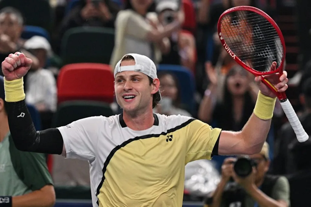 Belgium's Zizou Bergs celebrates after winning against Spain's Carlos Alcaraz during their men's singles match at the Shanghai Masters tennis tournament in Shanghai on October 12, 2026. Hector RETAMAL / AFP