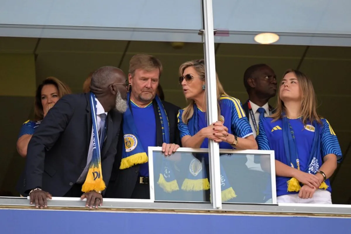 Curacao's Prime Minister Gilmar Pisas (L) talks with King Willem-Alexander of the Netherlands, Queen Maxima of the Netherlands and Princess Ariane of the Netherlands ahead of the 2026 World Cup Group E football match between Ecuador and Curacao at the Kansas City Stadium in Kansas City on June 20, 2026. JUAN MABROMATA / AFP