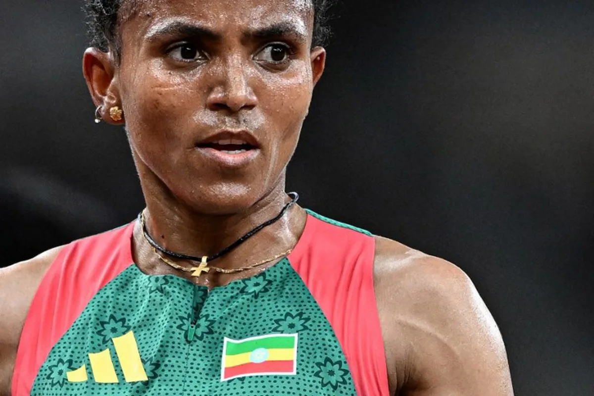 Ethiopia's Gudaf Tsegay reacts after competing in the women's 5000m heats during the World Athletics Championships in Tokyo on September 18, 2025. Jewel SAMAD / AFP