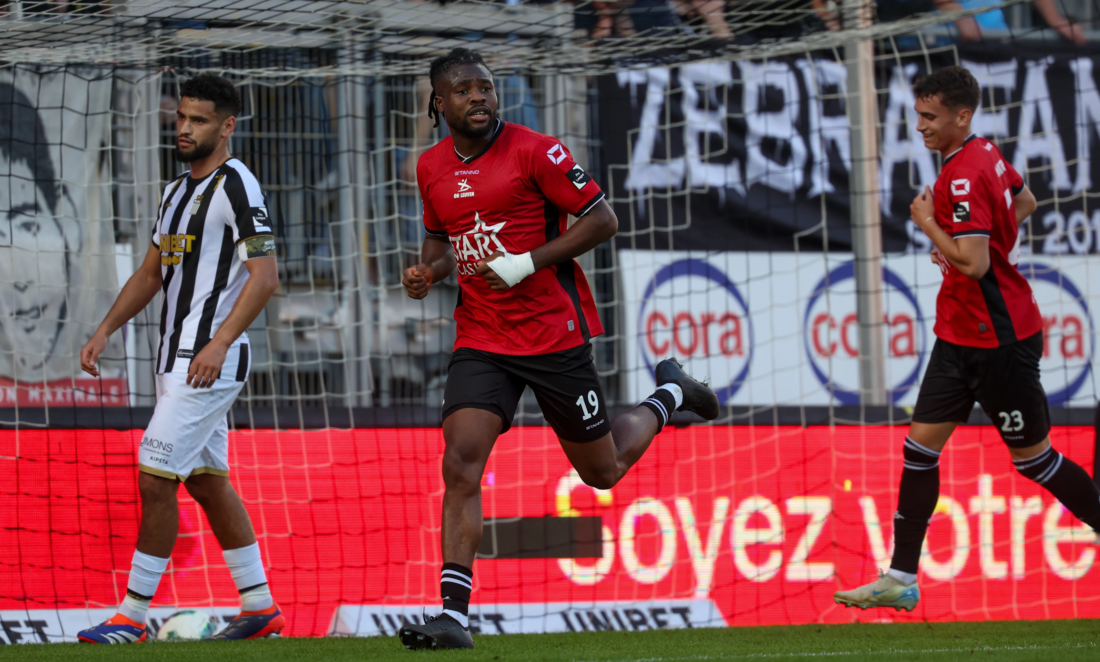 OHL's Chukwubuikem Ikwuemesi celebrates after scoring during a soccer match between Sporting Charleroi and Oud-Heverlee Leuven, Saturday 26 October 2024 in Charleroi, on day 12 of the 2024-2025 season of the 'Jupiler Pro League' first division of the Belgian championship. BELGA PHOTO VIRGINIE LEFOUR