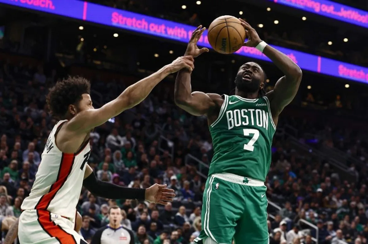 (FILES) Jaylen Brown #7 of the Boston Celtics is fouled by Cade Cunningham #2 of the Detroit Pistons during the second half at TD Garden on December 4, 2024 in Boston, Massachusetts. NOTE TO USER: User expressly acknowledges and agrees that, by downloading and/or using this Photograph, user is consenting to the terms and conditions of the Getty Images License Agreement.  Winslow Townson / GETTY IMAGES NORTH AMERICA / AFP