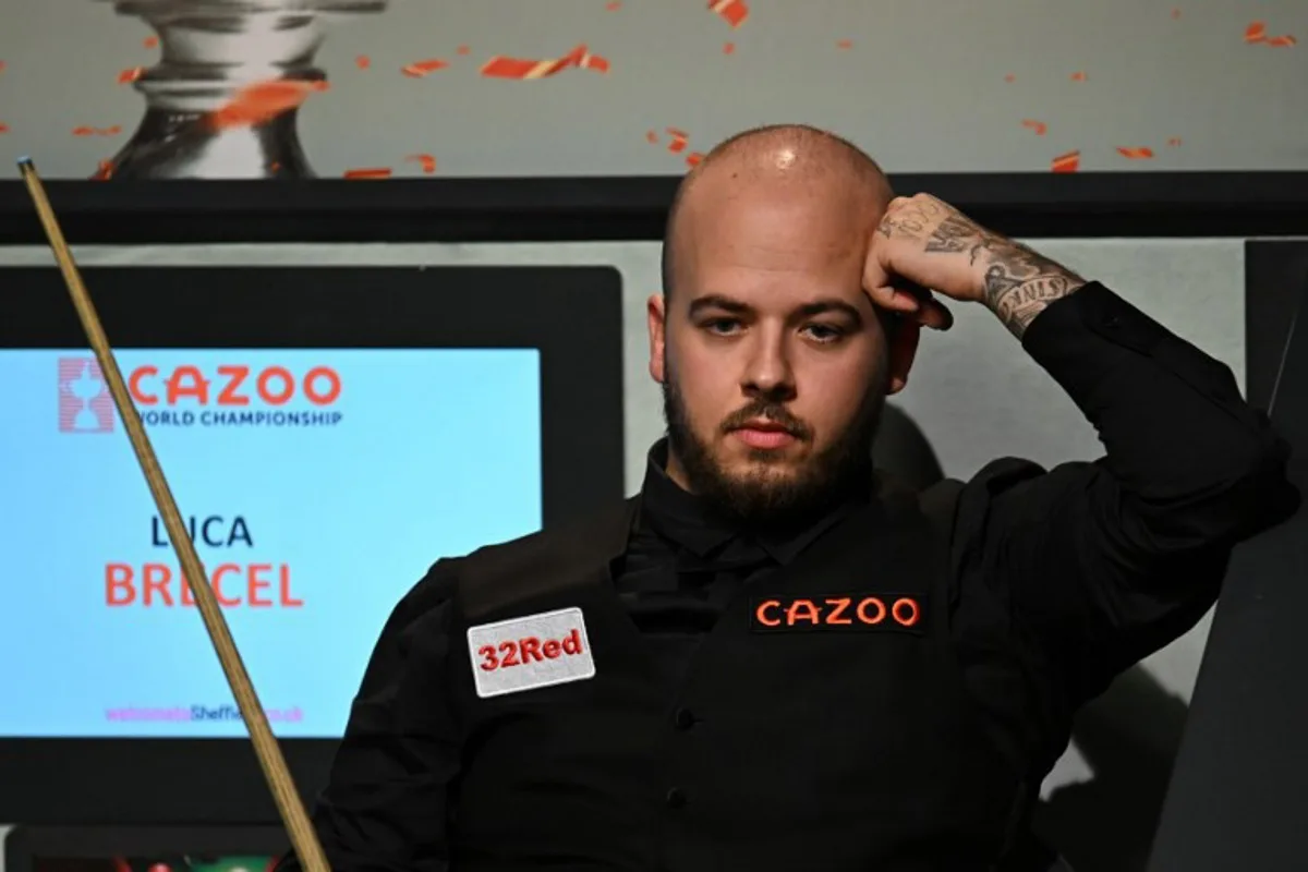 Belgium's Luca Brecel looks on from his seat playing against England's Mark Selby during the afternoon session on day two of their World Championship Snooker final match at The Crucible in Sheffield, northern England on May 1, 2023.   Oli SCARFF / AFP