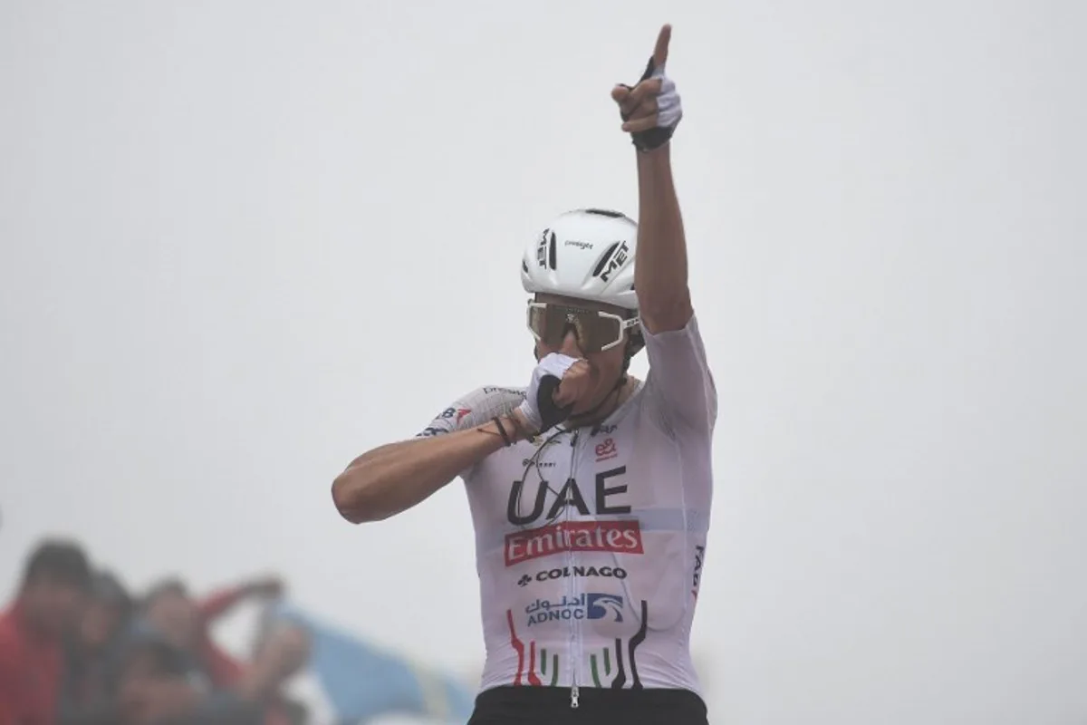 Team UAE's Marc Soler celebrates after crossing the finish line during the stage 16 of the Vuelta a Espana, a 181,5 km race between Luanco and Lagos de Covadonga, on September 3, 2024.    ANDER GILLENEA / AFP