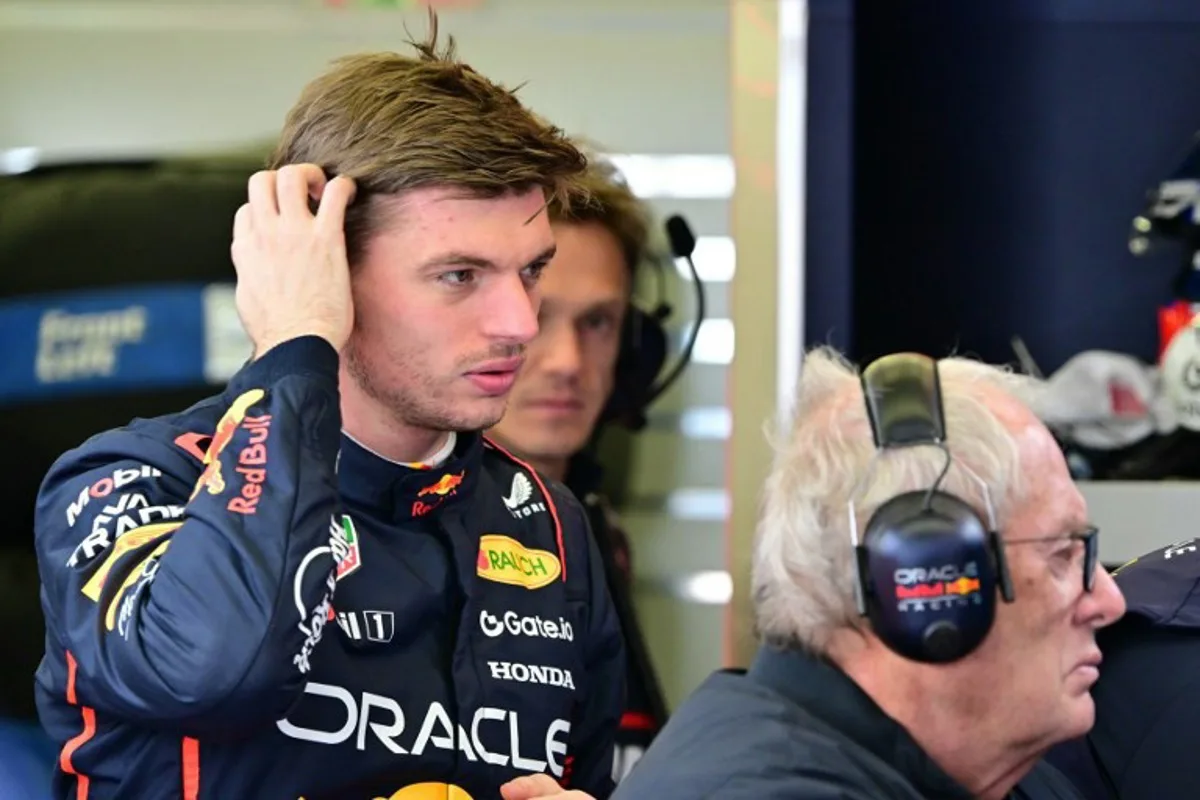 Red Bull Racing's Dutch driver Max Verstappen and Red Bull Racing team advisor Helmut Marko watch a screen on the third day of the Formula One pre-season testing at the Bahrain International Circuit in Sakhir on February 28, 2025.  Giuseppe CACACE / AFP