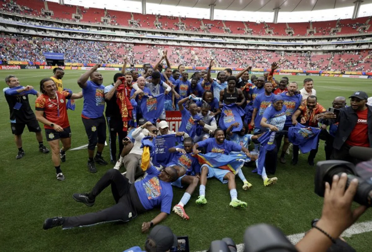 DR Congo players and coaching staff celebrate after winning the match and qualifying for the World Cup during the 2026 FIFA World Cup qualifiers final playoff football match between the Democratic Republic of the Congo and Jamaica at the Akron Stadium in Zapopan, Jalisco state, Mexico, on March 31, 2026.  Ulises Ruiz / AFP