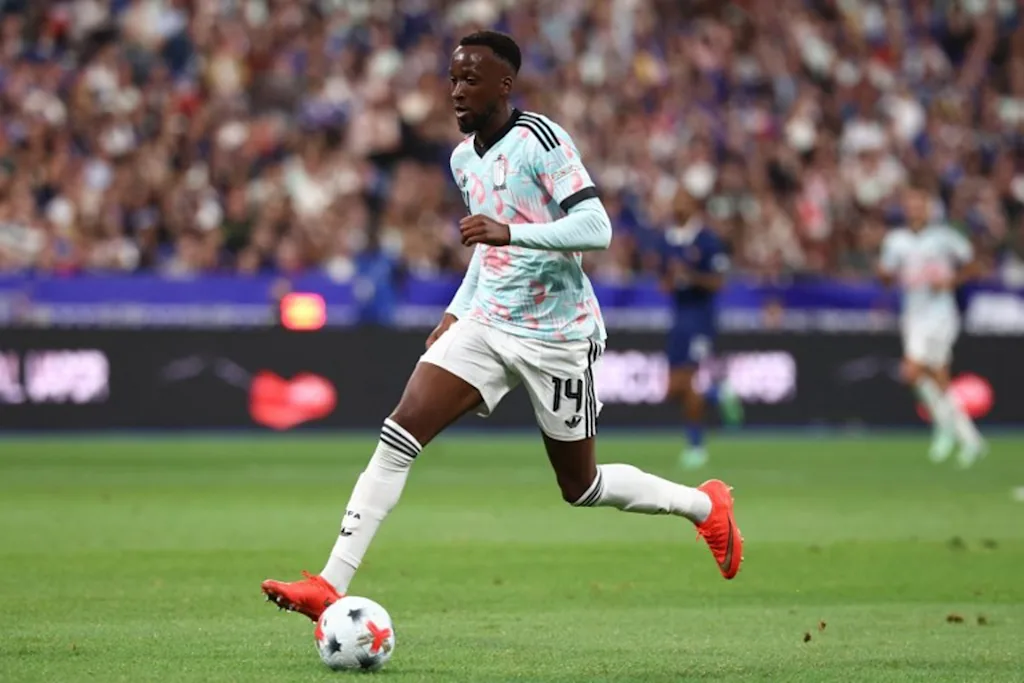 Belgium's forward #14 Dodi Lukebakio runs with the ball prior to scoring the opening goal during the UEFA Nations League Group A1 football match between France and Belgium at the Stade de France in Saint-Denis, north of Paris, on October 5, 2026. FRANCK FIFE / AFP