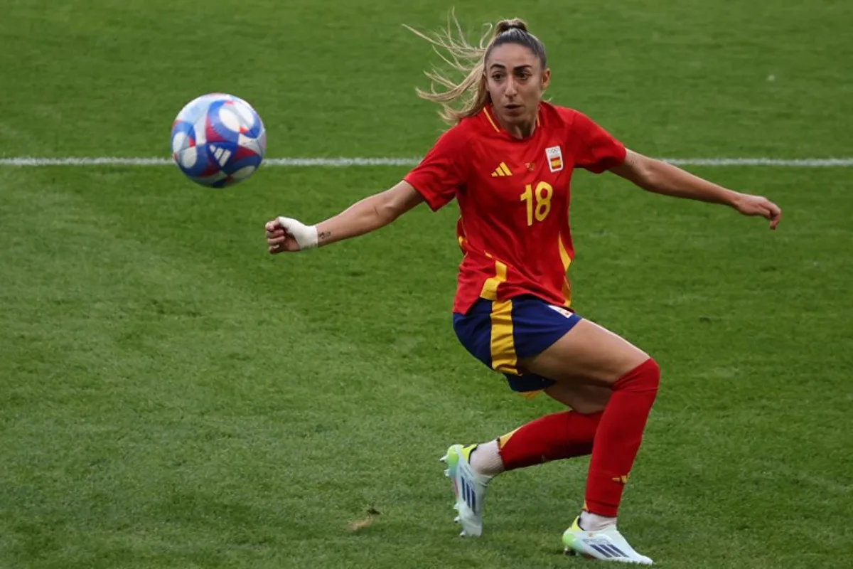 Spain's defender #18 Olga Carmona controls the ball in the women's group C football match between Spain and Nigeria during the Paris 2024 Olympic Games at the La Beaujoire Stadium in Nantes on July 28, 2024. ROMAIN PERROCHEAU / AFP