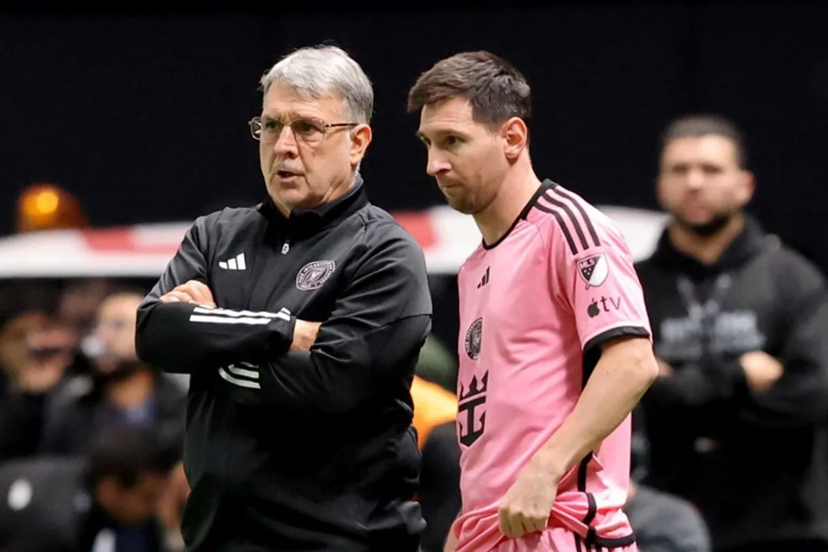 Inter Miami's Argentine coach Gerardo Martino stands with his Argentine forward #10 Lionel Messi before the latter enters the pitch during the friendly football match between Saudi Arabia's al-Nassr FC and the US Inter Miami CF at the Kingdom Arena Stadium in Riyadh on February 1, 2024.  AFP