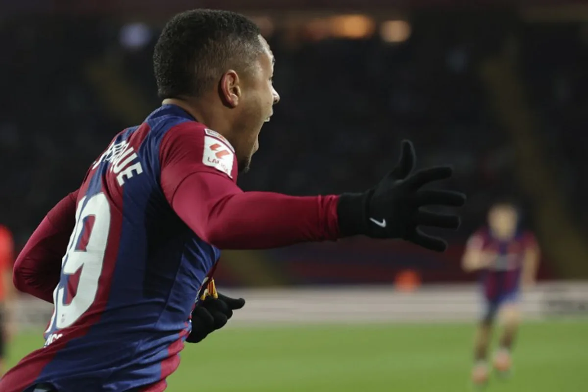 Barcelona's Brazilian forward #19 Vitor Roque celebrates scoring the opening goal during the Spanish league football match between FC Barcelona and CA Osasuna at the Estadi Olimpic Lluis Companys in Barcelona on January 31, 2024.  LLUIS GENE / AFP