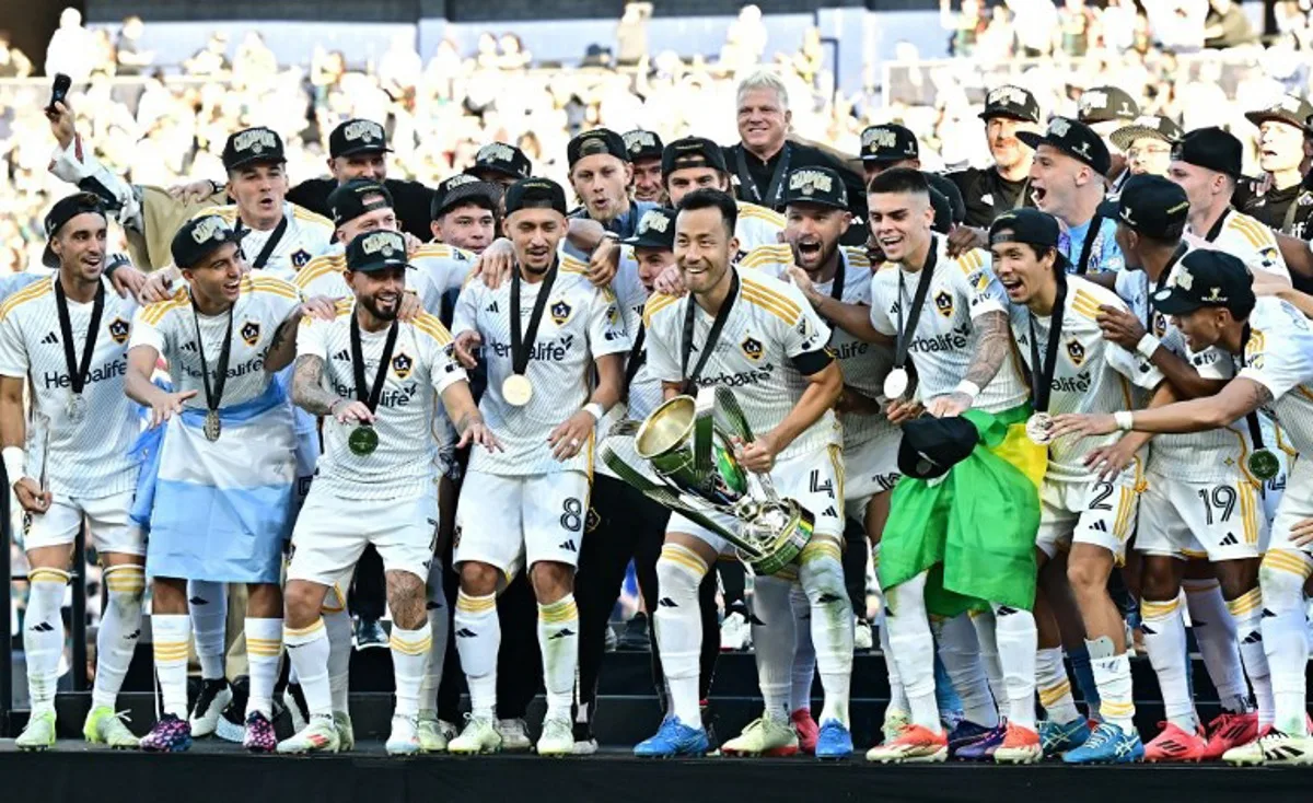 LA Galaxy's captain Japanese defender #04 Maya Yoshida prepares to lift the trophy as he celebrates with teammates following the Major League Soccer (MLS) Cup Final match between the LA Galaxy and the NY Red Bulls at the Dignity Health Sports Park in Carson, California, on December 7, 2024. Frederic J. BROWN / AFP