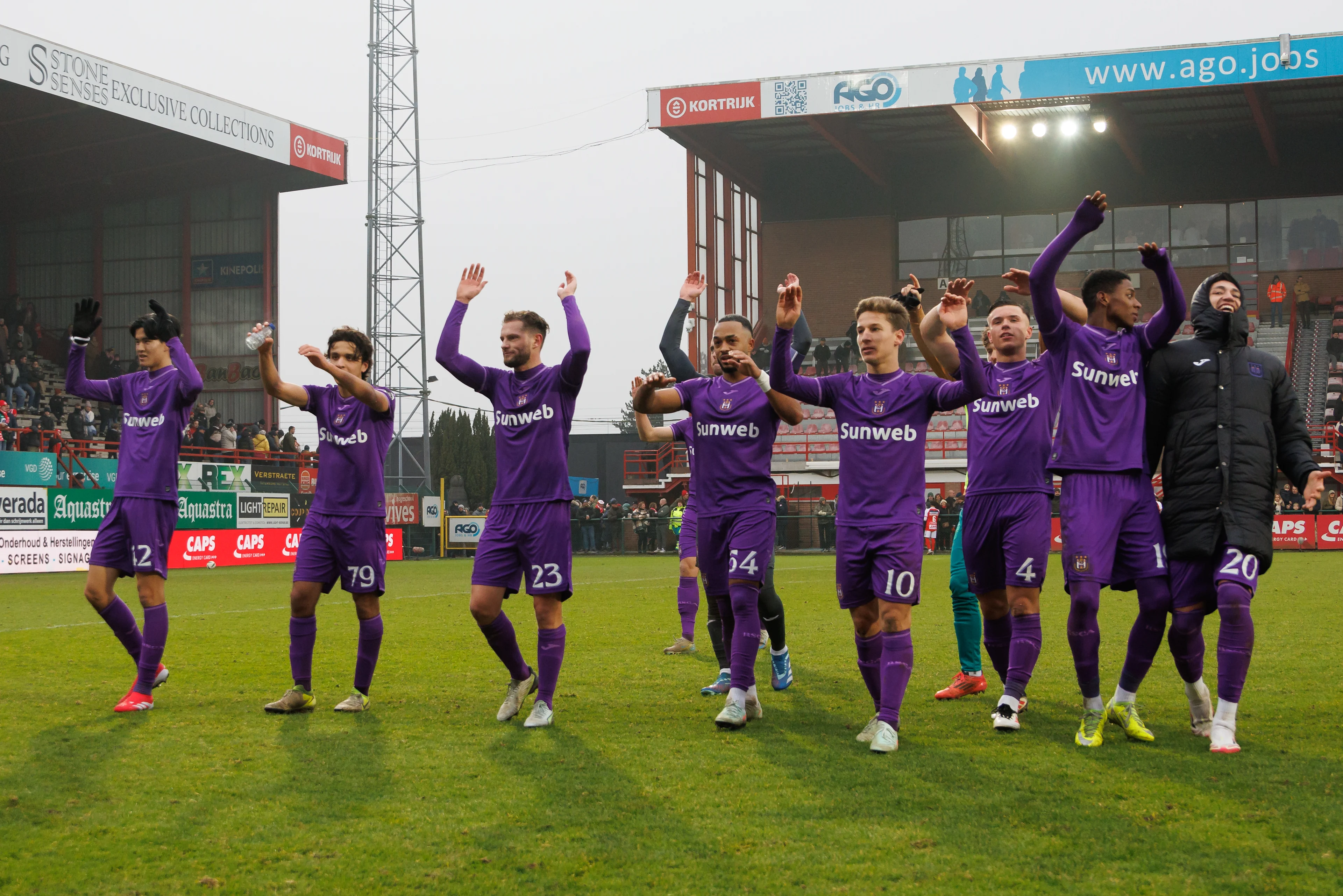 Anderlecht's players celebrate after winning a soccer match between KV Kortrijk and RSC Anderlecht, Sunday 19 January 2025 in Kortrijk, on day 22 of the 2024-2025 season of the 'Jupiler Pro League' first division of the Belgian championship. BELGA PHOTO KURT DESPLENTER