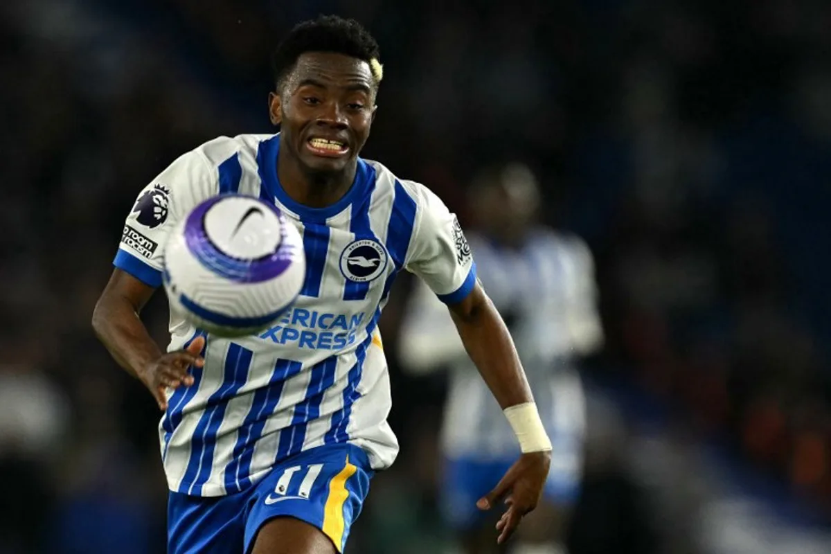 Brighton's Ivorian midfielder #11 Simon Adingra focuses on the ball during the English Premier League football match between Brighton and Hove Albion and Aston Villa at the American Express Community Stadium in Brighton, southern England on April 2, 2025. Glyn KIRK / AFP