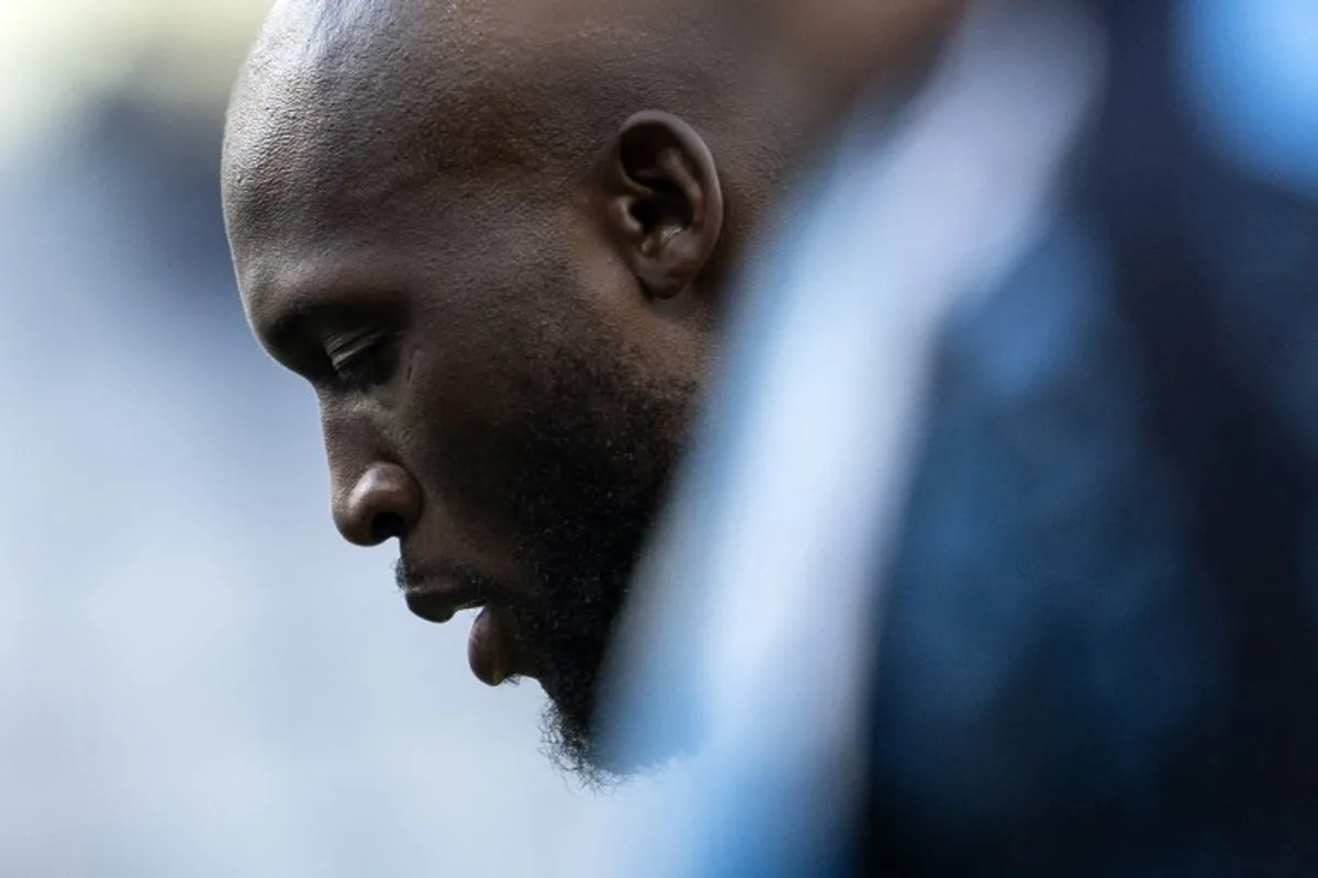 Napoli's Belgian forward #11 Romelu Lukaku warms up before the Italian Serie A football match Torino vs Napoli at the "Stadio Grande Torino" in Turin on December 1, 2024.   MARCO BERTORELLO / AFP