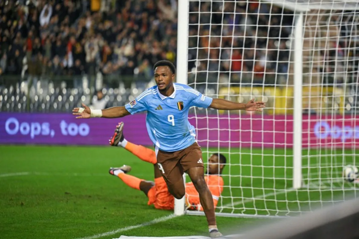 Belgium's forward #09 Lois Openda celebrates after scoring during the UEFA Nations League League A, Group A2 football match between Belgium and France, at the King Baudouin Stadium in Brussels, on October 14, 2024.  NICOLAS TUCAT / AFP