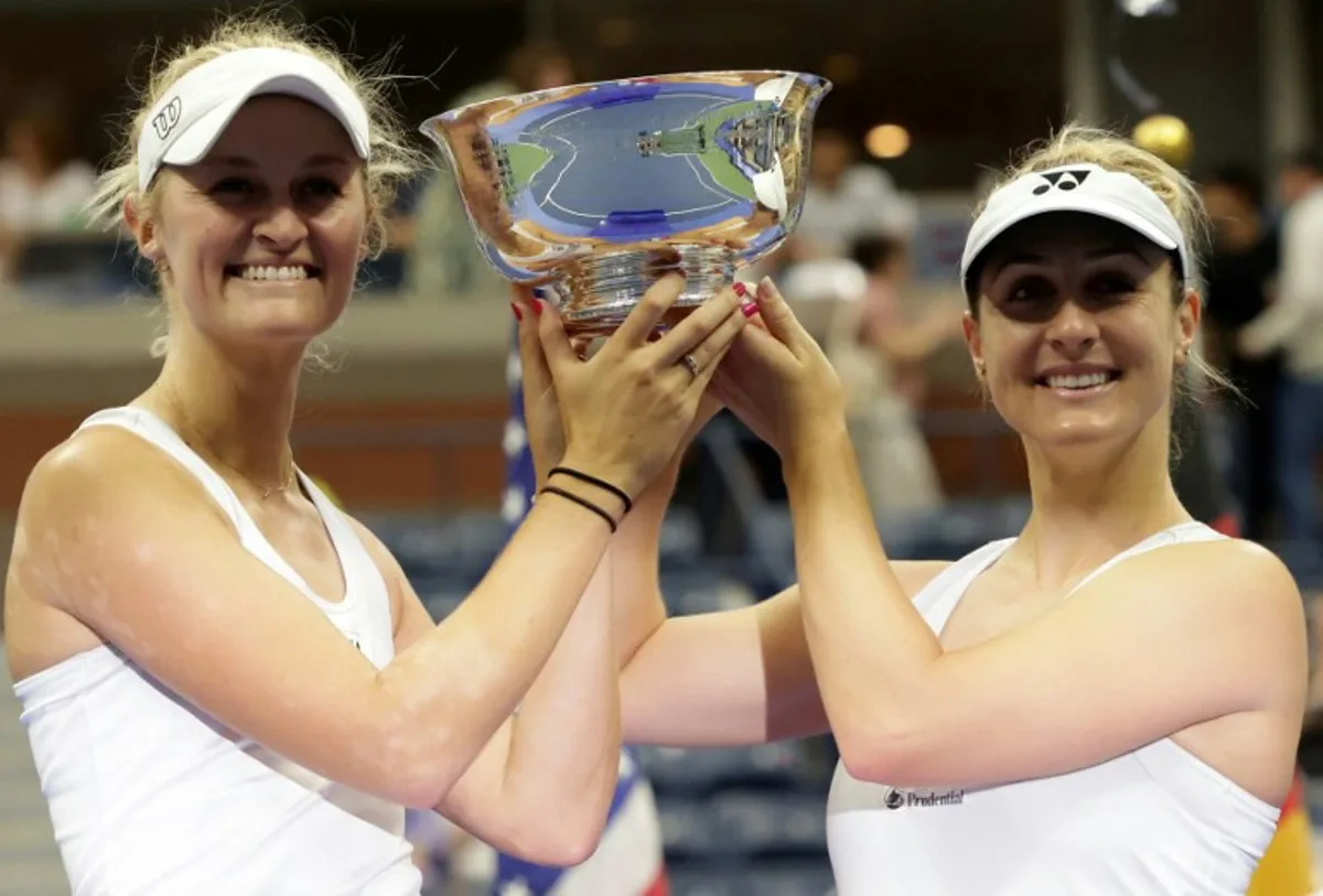 Canada's Gabriela Dabrowski and New Zealand's Erin Routliffe celebrate with the trophy following the US Open tennis tournament women's doubles final match at the USTA Billie Jean King National Tennis Center in New York City, on September 10, 2023. KENA BETANCUR / AFP