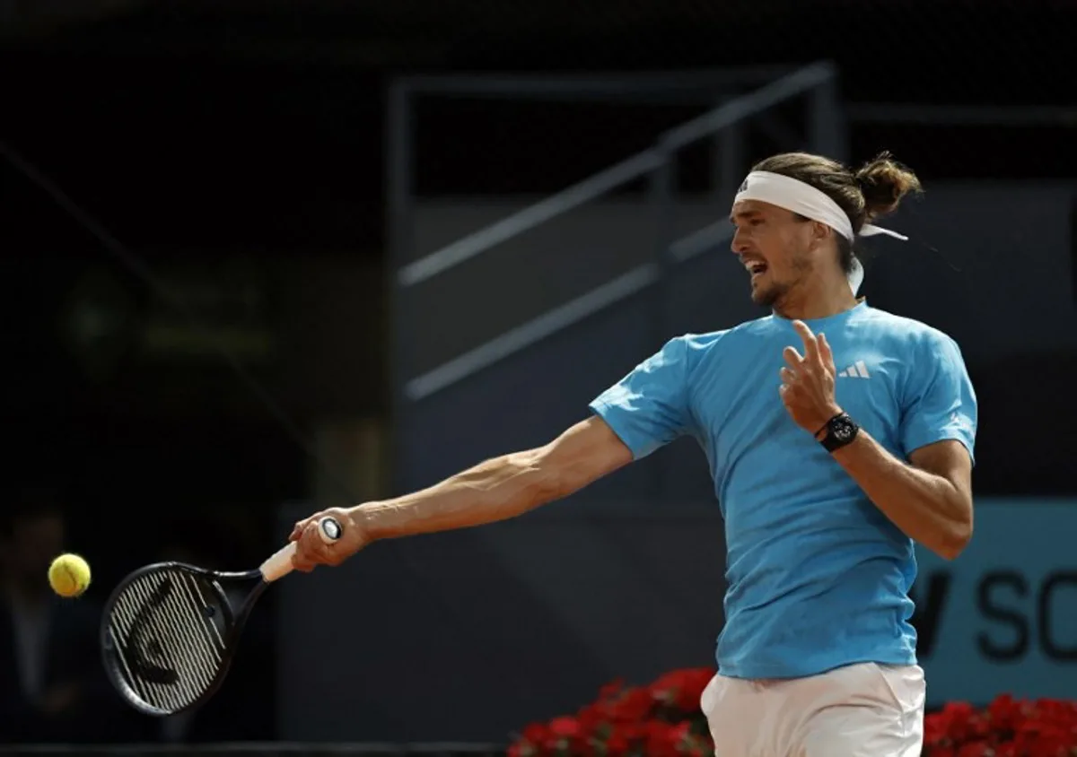 Germany's Alexander Zverev returns the ball to Czech Republic's Jakub Mensik during their 2026 ATP Tour Madrid Open tennis tournament singles match at the Caja Magica in Madrid, on April 28, 2026.  OSCAR DEL POZO / AFP