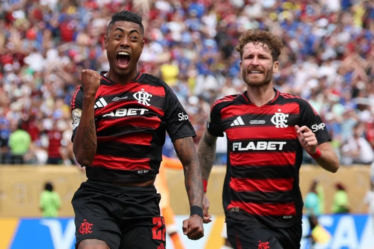 Flamengo's Brazilian forward #27 Bruno Henrique (L) celebrates next to teammate Brazilian defender #04 Leo Pereira after scoring his team's first goal during the FIFA Club World Cup 2025 Group D football match between Brazil's CR Flamengo and England's Chelsea at the Lincoln Financial Field stadium in Philadelphia on June 20, 2025. FRANCK FIFE / AFP