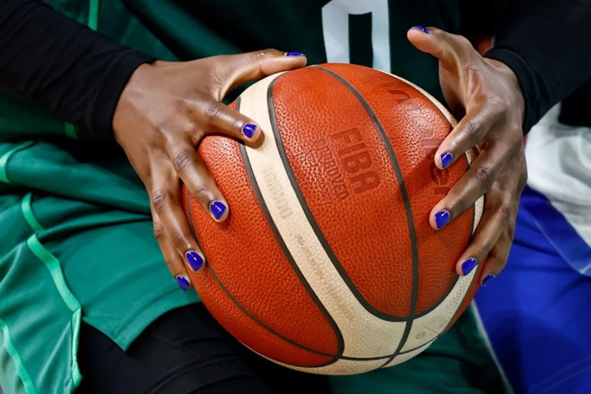 Nigeria's #0 Amy Okonkwo holds the ball in the women's preliminary round group B basketball match between France and Nigeria during the Paris 2024 Olympic Games at the Pierre-Mauroy stadium in Villeneuve-d'Ascq, northern France, on August 1, 2024.  Sameer Al-Doumy / AFP