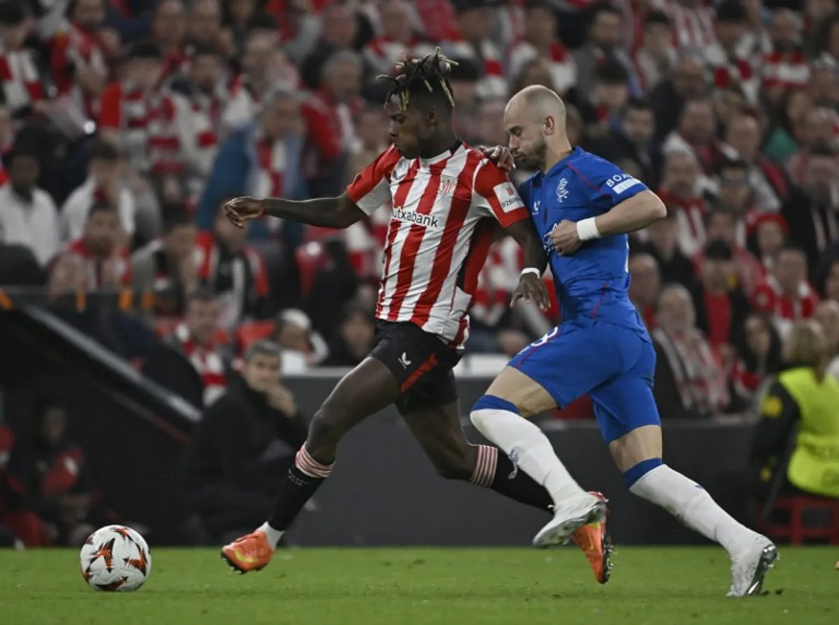 Athletic Bilbao's Spanish forward #10 Nico Williams fights for the ball with Rangers' Czech midfielder #18 Vaclav Cerny during the UEFA Europa League quarter final second leg football match between Athletic Club Bilbao and Glasgow Rangers, at the San Mames stadium in Bilbao on April 17, 2025. ANDER GILLENEA / AFP