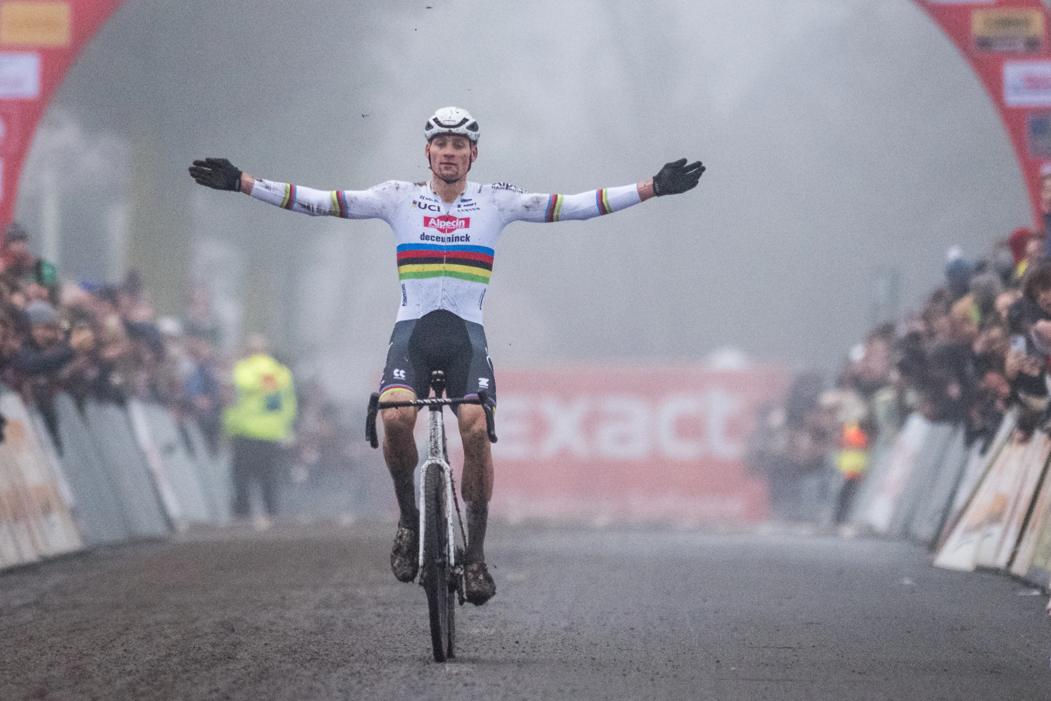 Dutch Mathieu Van Der Poel celebrates as he crosses the finish line to win the men's elite race of the cyclocross cycling event, race 5/7 in the 'Exact Cross' competition, Friday 27 December 2024 in Loenhout. BELGA PHOTO BILLY CEUSTERS