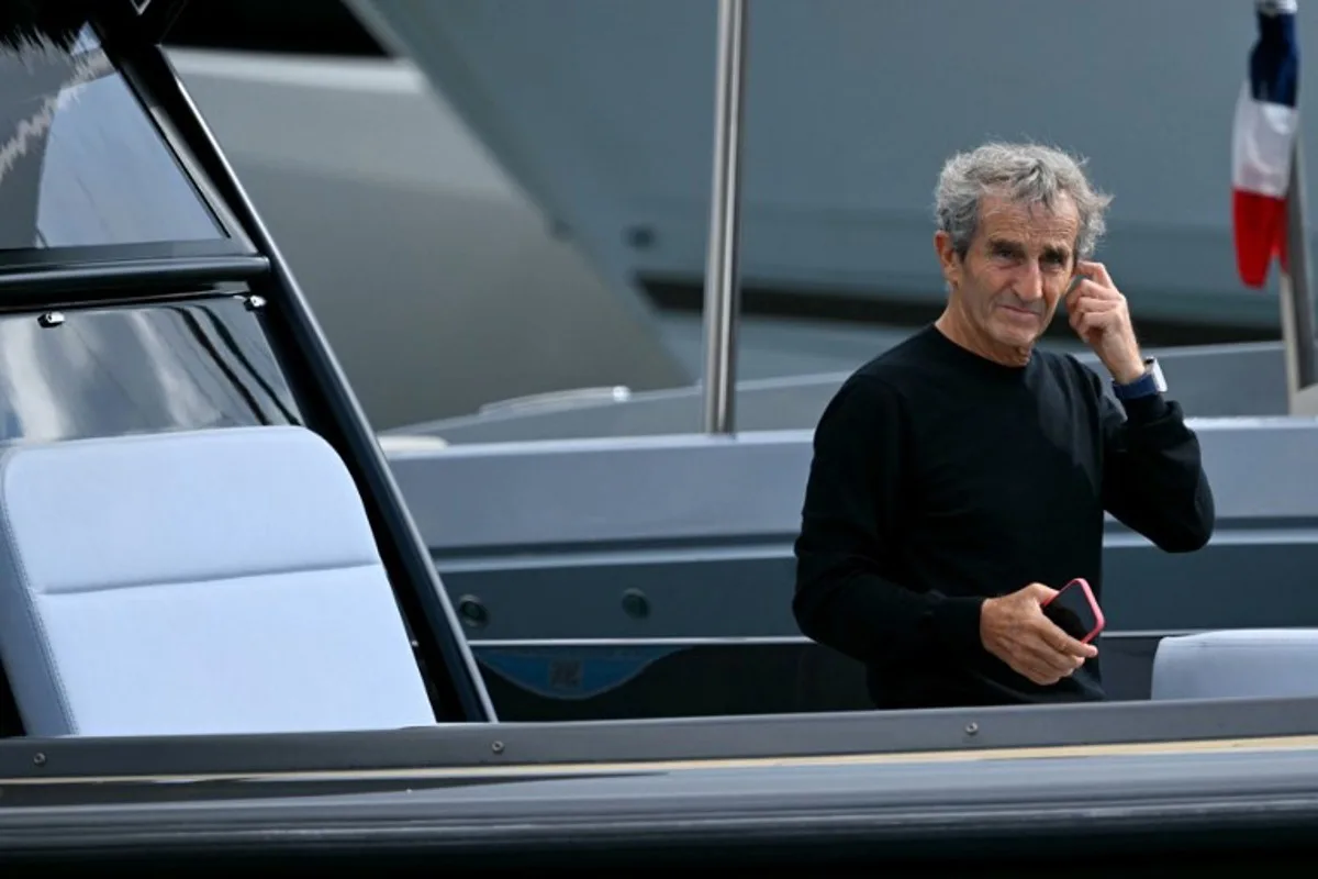 French former driver Alain Prost arrives by boat in the paddock of the Circuit de Monaco before the third practice session of the Formula One Monaco Grand Prix on May 25 2024, on the eve of the race. NICOLAS TUCAT / AFP