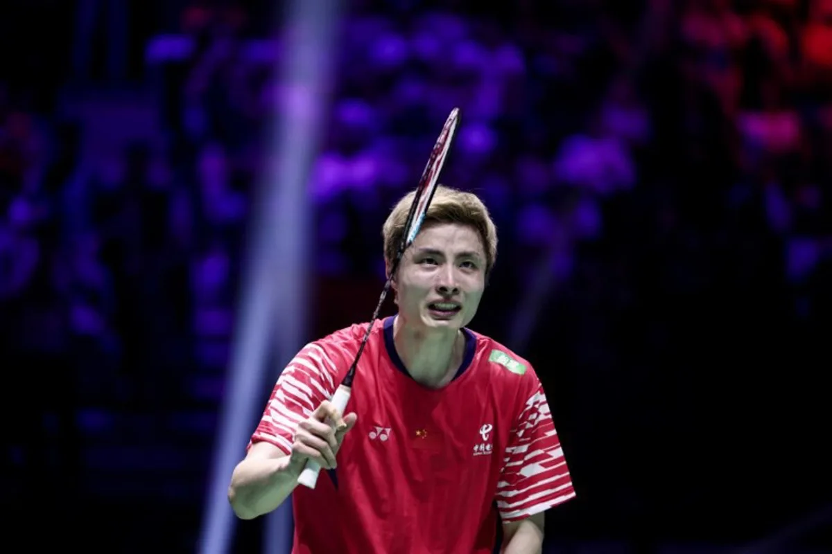 China's Shi Yuqi reacts after winning the men's singles final match against Thailand's Kunlavut Vitidsarn at the Badminton BWF World Championships at the Adidas Arena in Paris, on August 31, 2025. Thibaud MORITZ / AFP