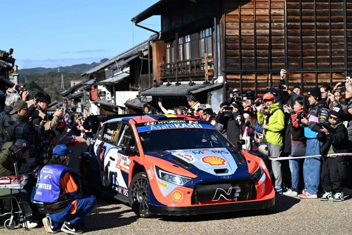 Thierry Neuville and his co-driver Martijn Wydaeghe of Belgium drive their Hyundai i20 N Rally1 Hybrid past the traditional Japanese townscape of Iwamura town during the Rally Japan, the 13th and final round of 2024 FIA World Rally Championships, in Ena city, Gifu prefecture on November 23, 2024.  Toshifumi KITAMURA / AFP