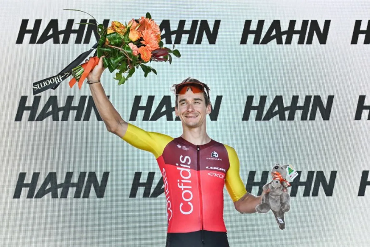 Cofidis rider Bryan Coquard from France waves from the podium after winning stage 4 of the Tour Down Under cycling race in Adelaide on January 24, 2025.  Brenton Edwards / AFP