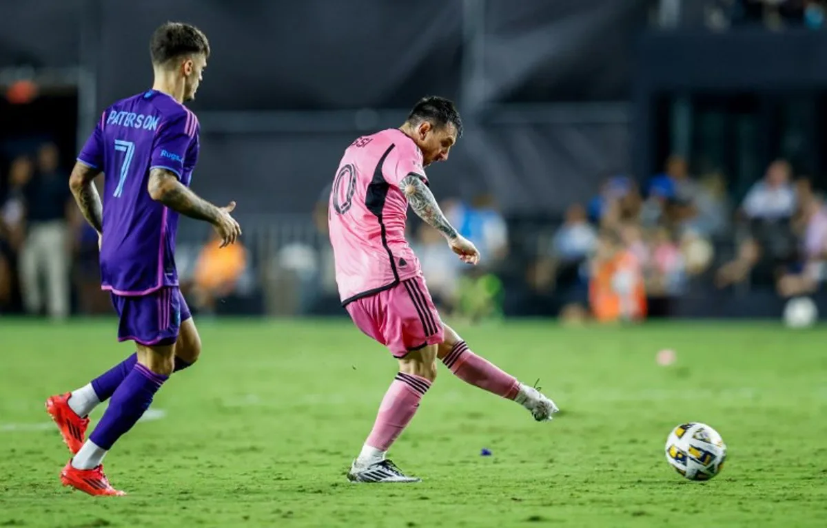 Inter Miami's Argentine forward #10 Lionel Messi kicks the ball in front of Charlotte's Paraguayan midfielder #07 Jamie Paterson during the Major League Soccer (MLS) football match between Inter Miami and Charlotte FC at Chase Stadium in Fort Lauderdale, Florida, September 28, 2024.  Chris ARJOON / AFP