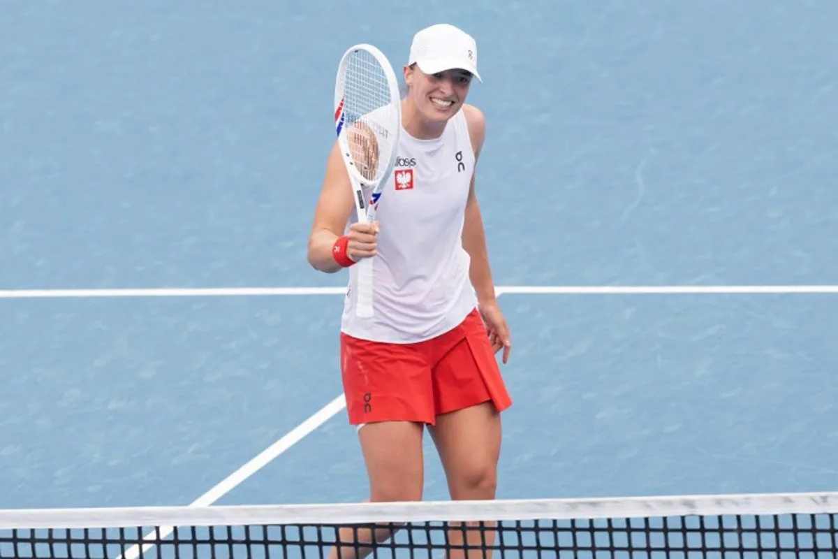 Poland's Iga Swiatek celebrates after victory against Kazakhstan's Elena Rybakina during their women's semi-final match at the United Cup tennis tournament on Ken Rosewall Arena in Sydney on January 4, 2025.   Steve CHRISTO / AFP