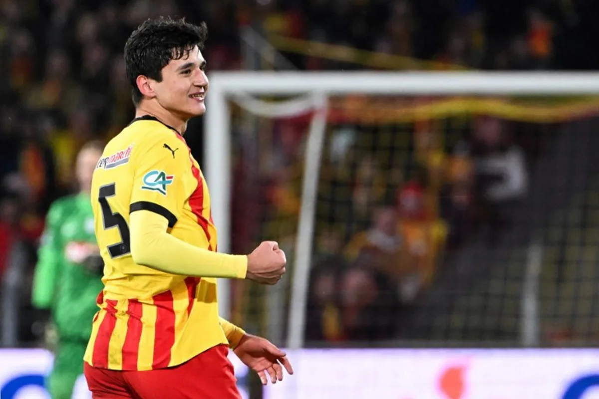 Lens Uzbek defender #25 Abdukodir Khusanov reacts during the French Cup round of 64 football match between Lens and  Paris Saint-Germain, at the Bollaert-Delelis Stadium in Lens, northern France, on December 22, 2024.  FRANCOIS NASCIMBENI / AFP