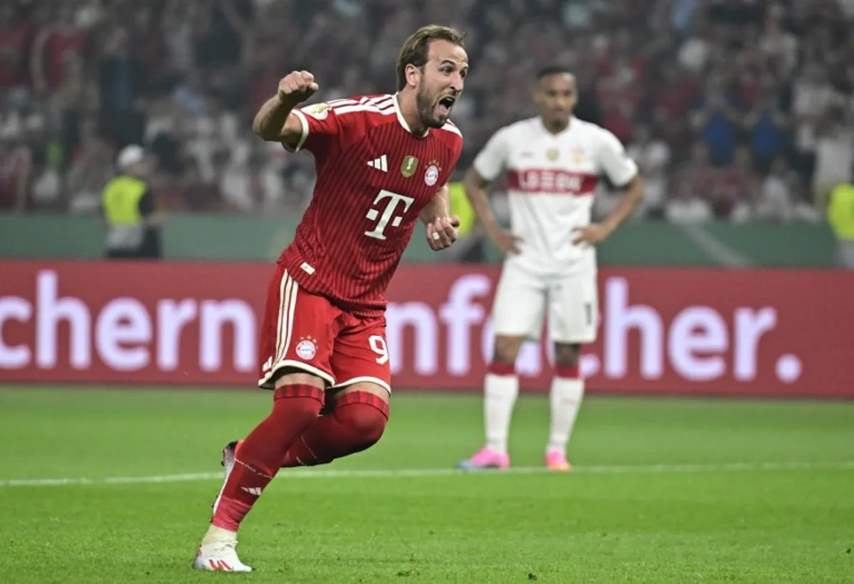 Bayern Munich's English forward #09 Harry Kane celebrates after scoring a penalty during the German Cup (DFB Pokal) final football match FC Bayern Munich v VfB Stuttgart at the Olympic Stadium in Berlin, on May 23, 2026. Tobias SCHWARZ / AFP