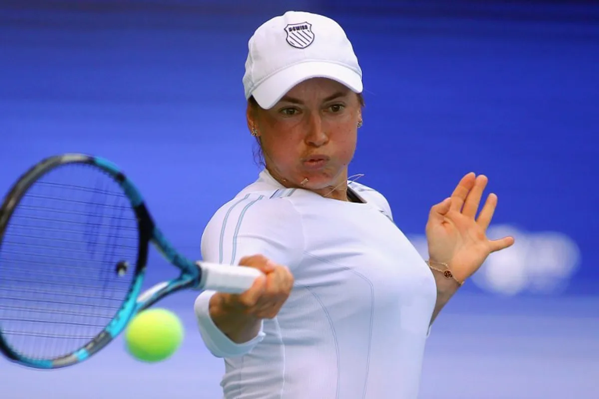 Kazakhstan's Yulia Putintseva hits a return against Russia's Daria Kasatkina during their women's singles quarter-final match at the WTA Ningbo Open tennis tournament in Ningbo, in eastern China's Zhejiang province on October 18, 2024.  STRINGER / AFP