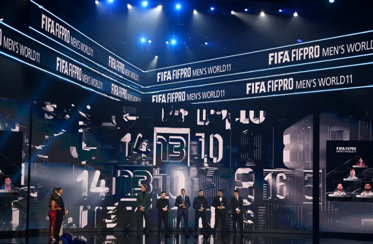 (From L) Netherlands and Liverpool defender Virgil van Dijk, Argentina and Paris Saint-Germain forward Lionel Messi, France and Paris Saint-Germain forward Kylian Mbappe, Morocco and Paris Saint-Germain defender Achraf Hakimi, Brazil and Manchester United midfielder Casemiro and Portugal and bayern Munich defender Joao Cancelo pose on stage as they receive awards for the FIFA FIFPRO men's World11 during the Best FIFA Football Awards 2022 ceremony in Paris on February 27, 2023.  FRANCK FIFE / AFP