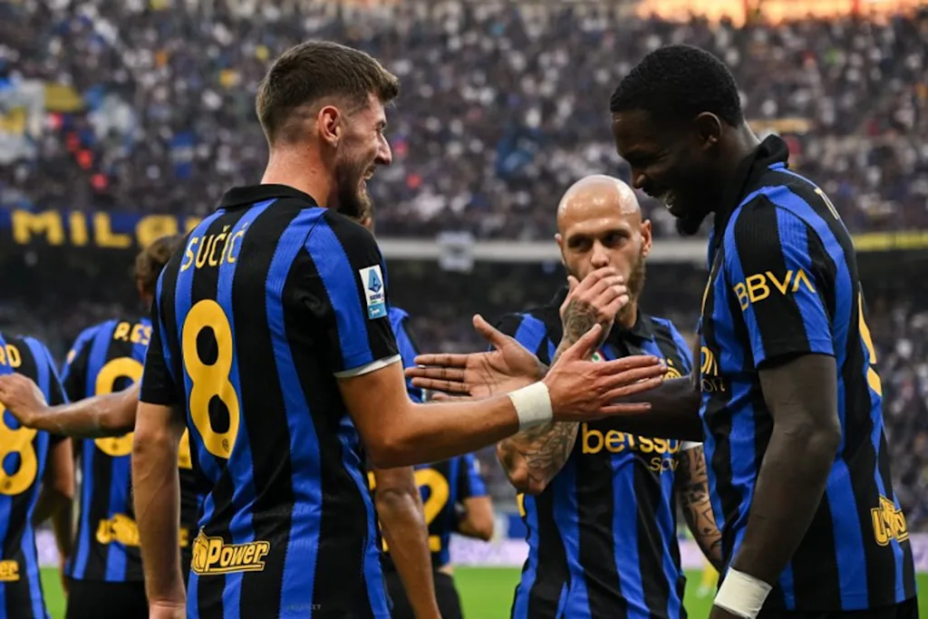 Inter Milan's Croatian midfielder #8 Petar Sucic (L) celebrates with teammates after scoring a goal during the Italian Serie A football match between Inter Milan and Parma at the San Siro Stadium in Milan, on October 10, 2026.  Piero CRUCIATTI / AFP