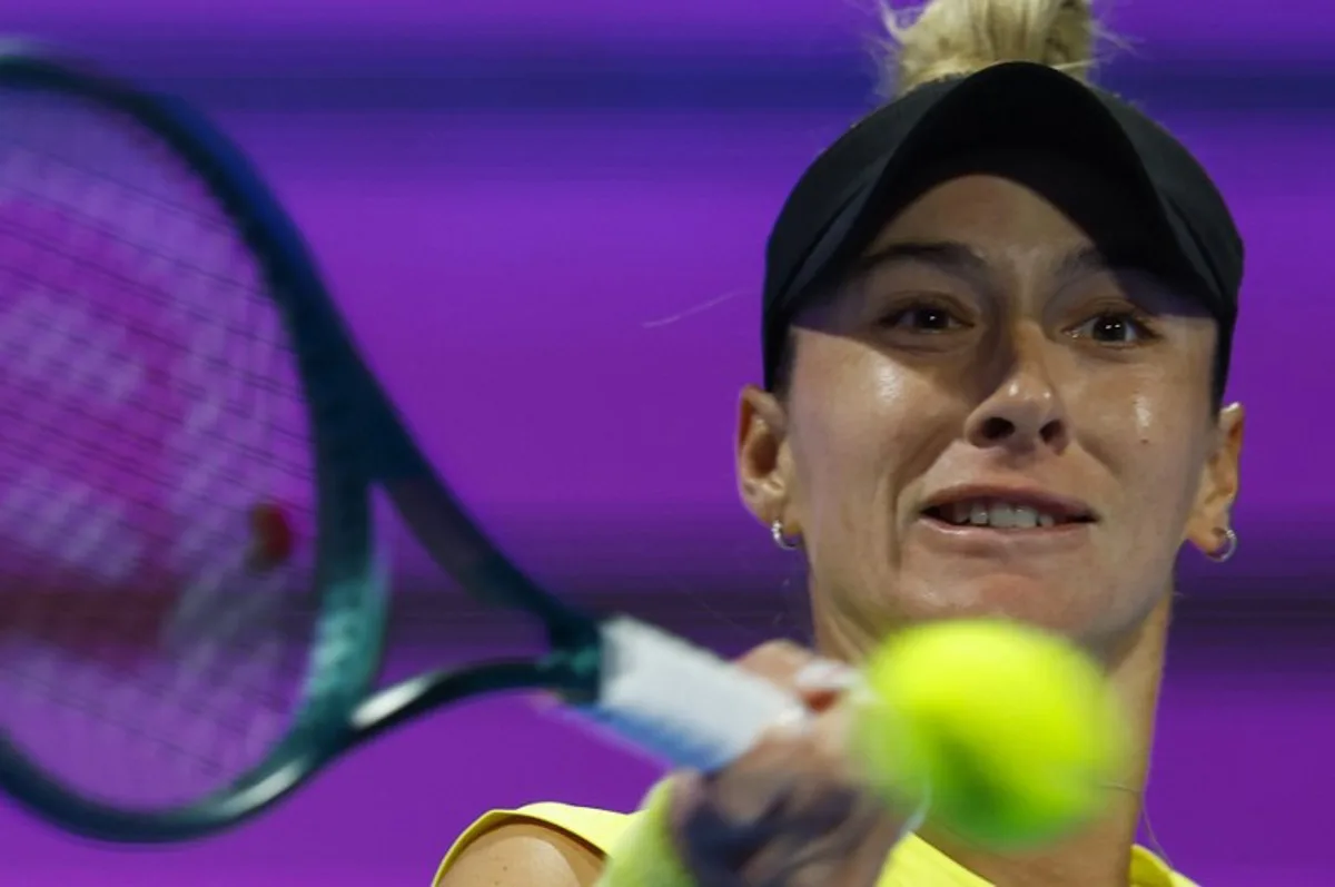 McCartney Kessler of the USA returns the ball to Ons Jabeur of Tunisia during their 2025 WTA Qatar Open match at the Khalifa International Tennis Complex in Doha on February 10, 2025. KARIM JAAFAR / AFP