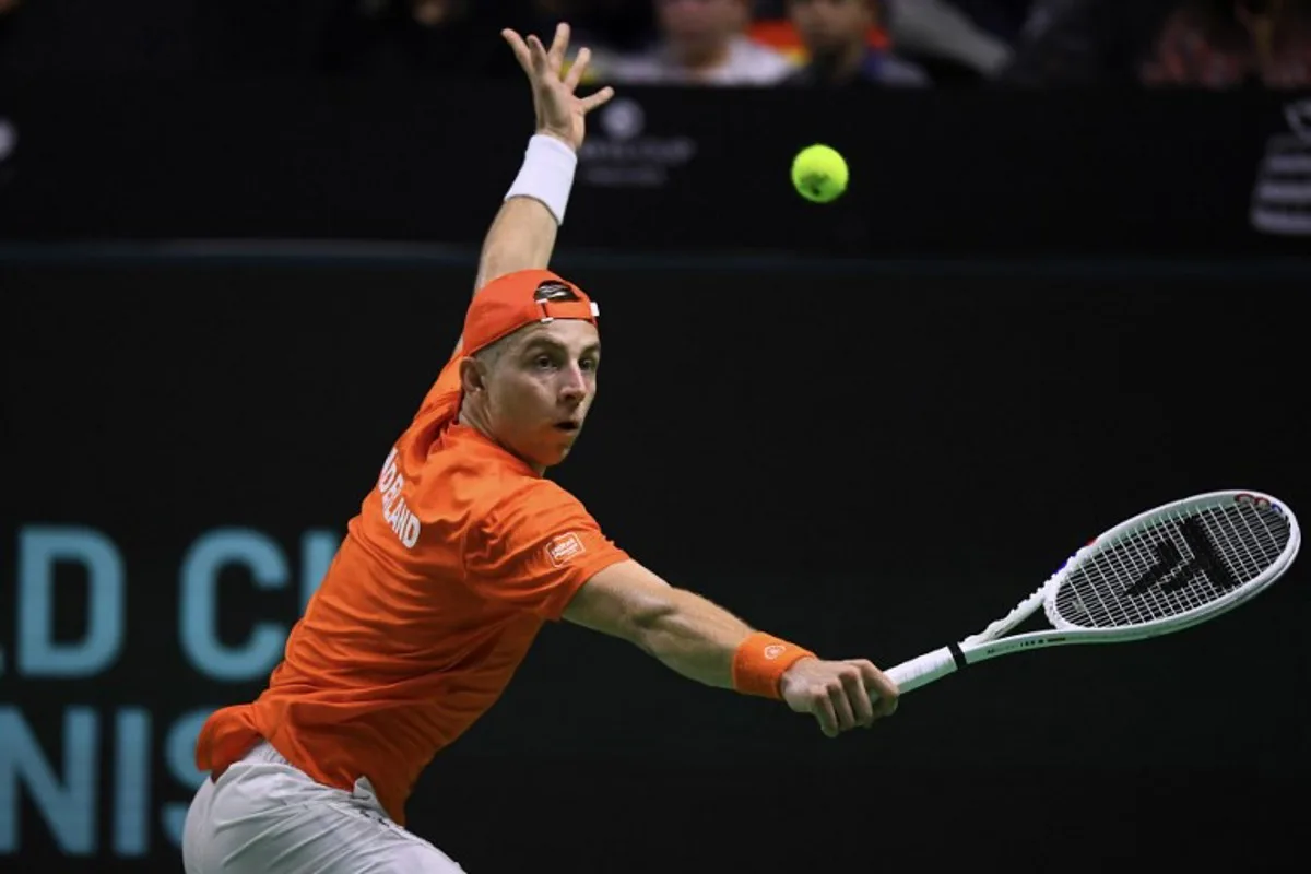 Tallon Griekspoor of Team Netherlands returns a shot to Jan-Lennard Struff of Team Germany during their semi-final singles match between Germany and Netherlands at the Davis Cup Finals at the Palacio de Deportes Jose Maria Martin Carpena arena in Malaga, southern Spain, on November 22, 2024.  JORGE GUERRERO / AFP