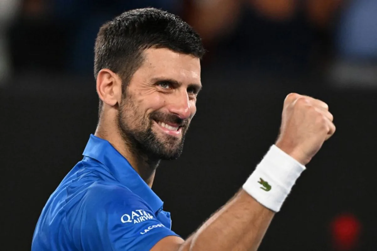 Serbia's Novak Djokovic celebrates after victory against Portugal's Jaime Faria during their men's singles match on day four of the Australian Open tennis tournament in Melbourne on January 15, 2025.  WILLIAM WEST / AFP